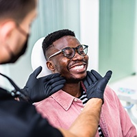 Man smiling at the dentist