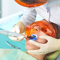 Dental patient receiving tooth-colored filling