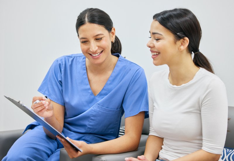 A woman asking questions before a smile makeover